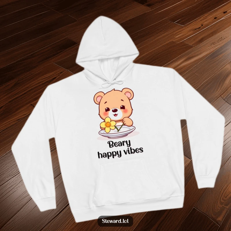 Funny hoodie featuring a happy bear cub adorably placing a flower on a plate, creating a cozy and heartwarming visual.